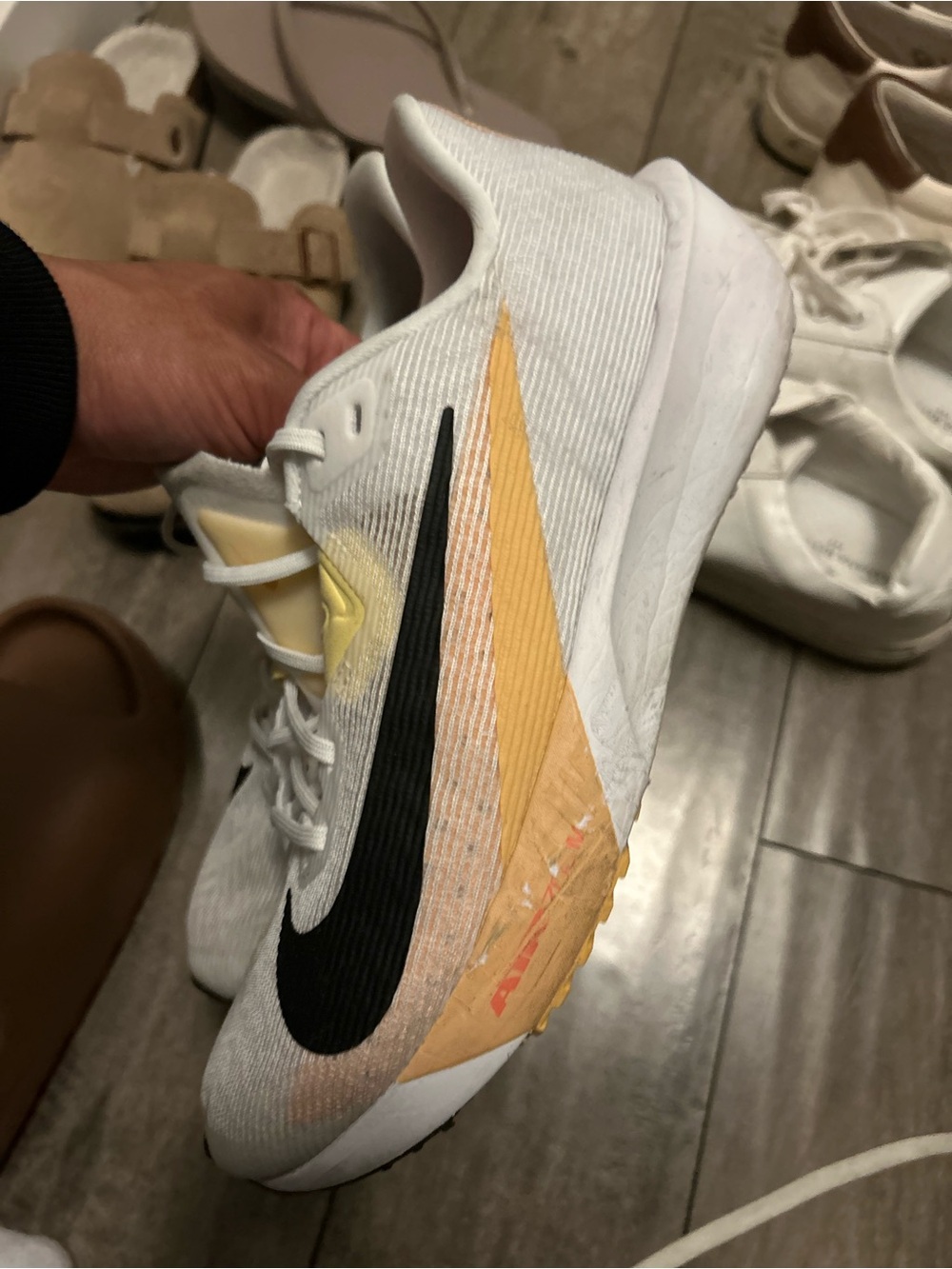 Nike White Trainer with Black Swoosh and Yellow Accent